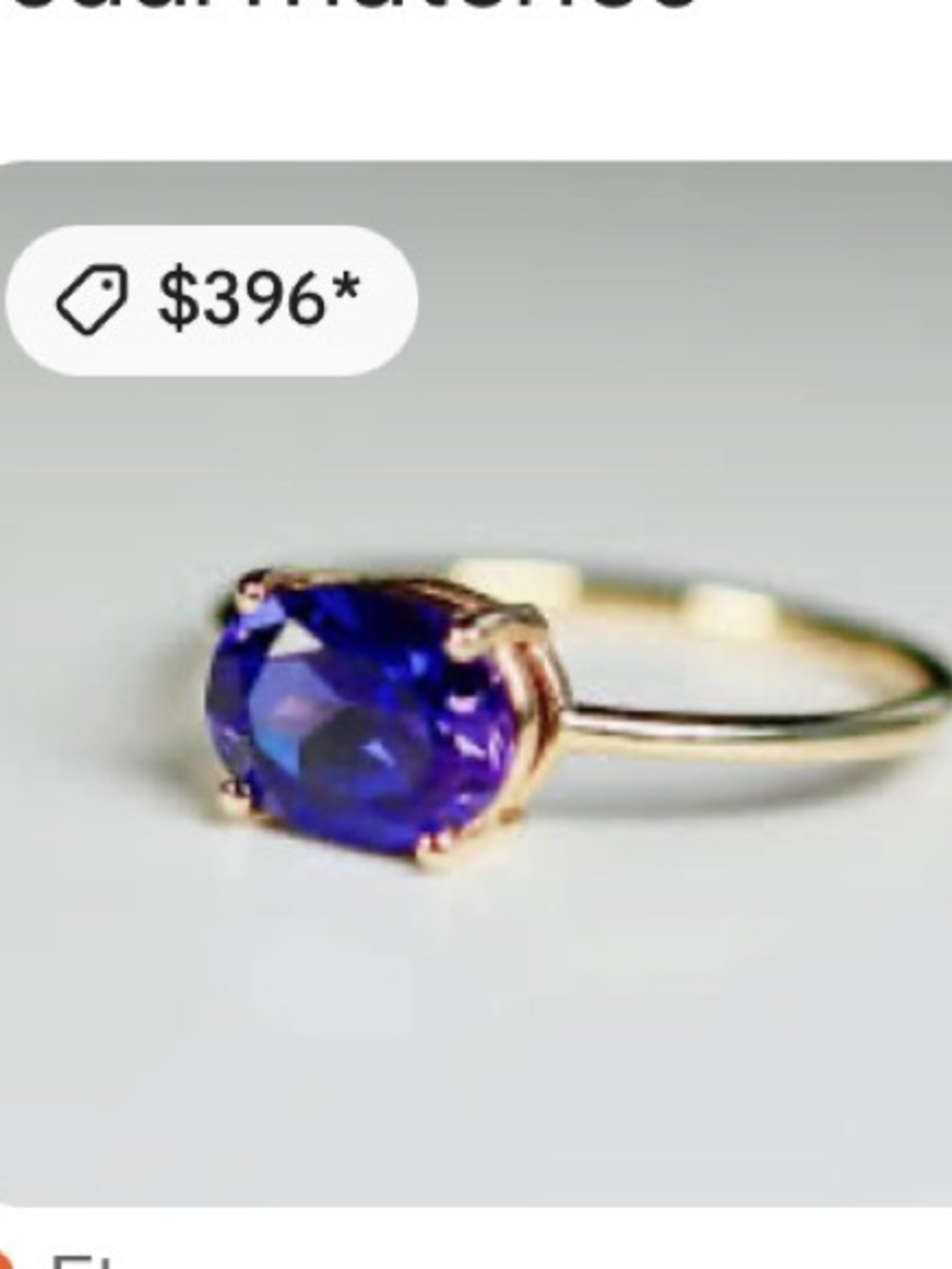 Delicate Gold Ring with Deep Purple Oval Stone